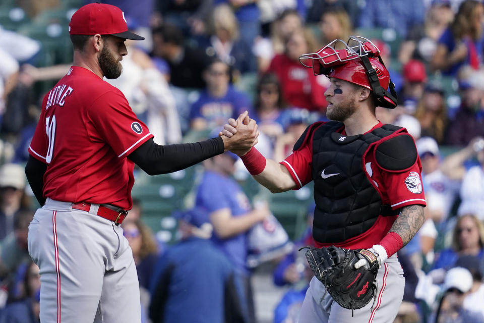 Cincinnati Reds relief pitcher Tejay Antone, left, celebrates with catcher Tucker Barnhart after they defeated the Chicago Cubs in a baseball game in Chicago, Sunday, May 30, 2021. (AP Photo/Nam Y. Huh)