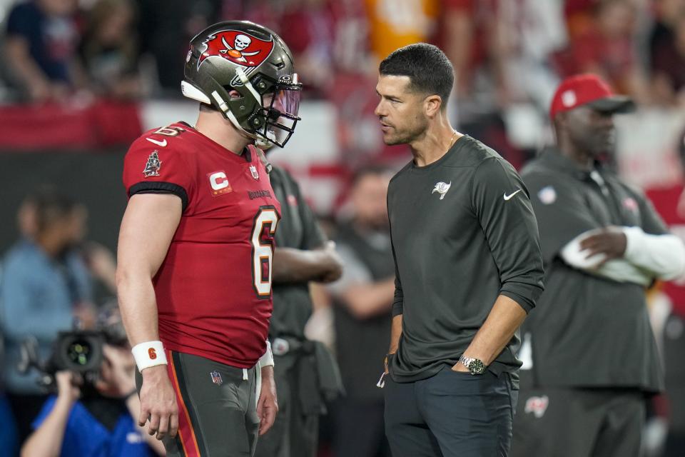 Tampa Bay Buccaneers quarterback Baker Mayfield, left, talks to offensive coordinator Dave Canales prior to a game against the Philadelphia Eagles, Monday, Jan. 15, 2024.