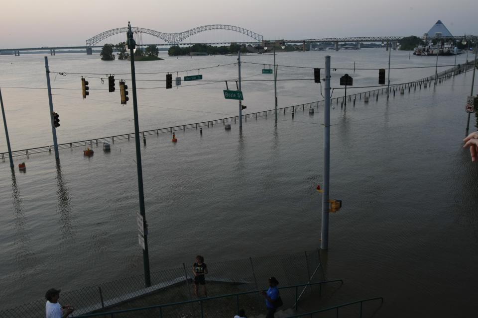 May 9, 2011: Riverside Drive is submerged at the foot of Beale Street. The Mississippi River in Memphis, usually a half-mile wide, now measures 3 miles across. The river is expected to crest at 48 feet, just below the record set in 1937 of 48.7 feet. It is the first time the Mississippi River has exceeded even 41 feet since that record 1937 flood.