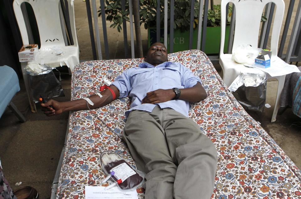 A man donates blood at a temporary donation centre for victims of a shopping mall shooting spree in Nairobi