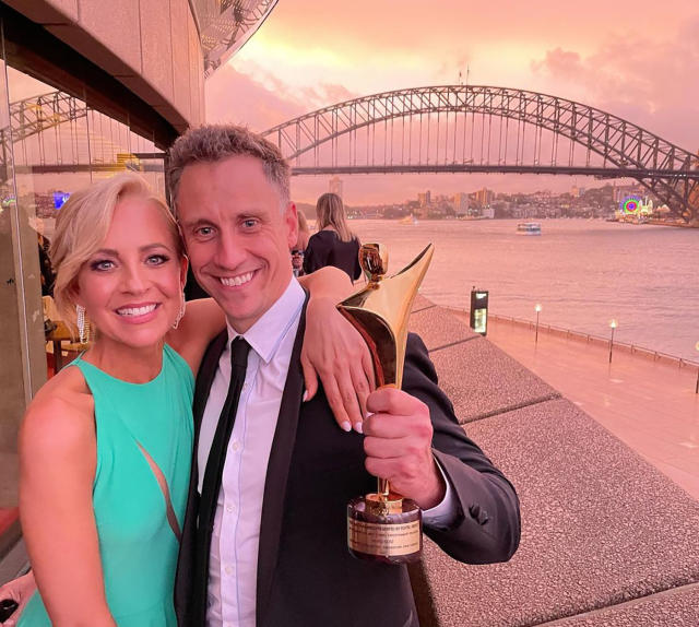 Carrie Bickmore and Chris Walker in front of the Sydney Harbour Bridge