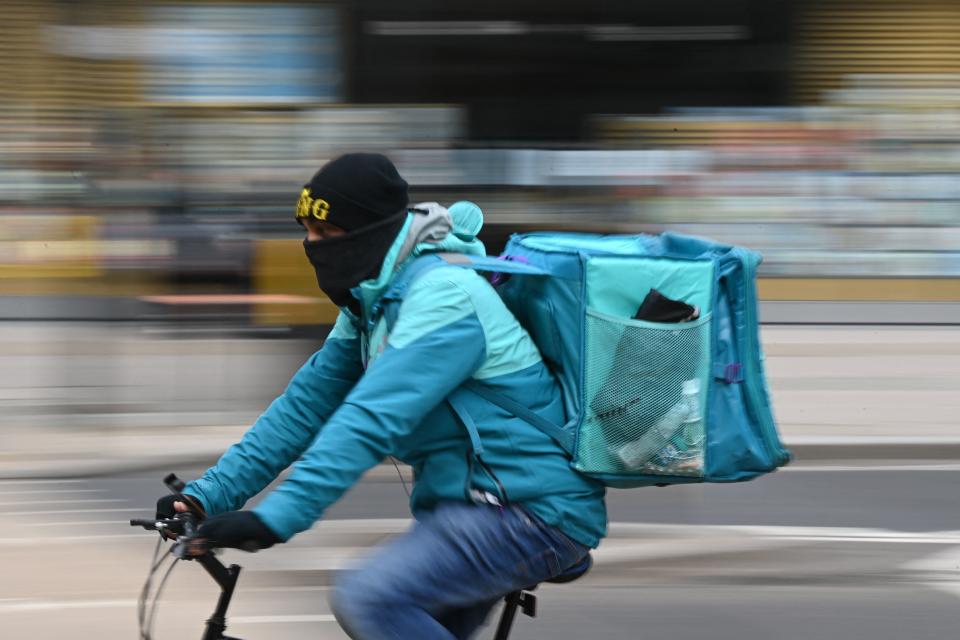 A Deliveroo rider cycles through central London. Photo: Daniel Leal-Olivas/AFP via Getty Images