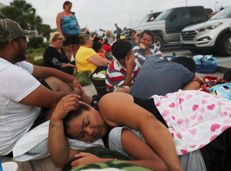 Homestead, Florida resident,  Lucy Villasenor and Yanell Roacha wait to enter Ray V. Pottorf Elementary School in Fort Myers with her family on Saturday 9/9/2017 morning. It is a shelter for those fleeing Hurricane Irma. They are one of the shelters offering a safe haven for pets as well. She and her family came over to the west coast to flee Irma from the east coast only to find themselves back in her path.