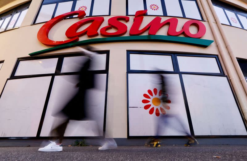 FILE PHOTO: FILE PHOTO: People walk past a Casino supermarket in Nice