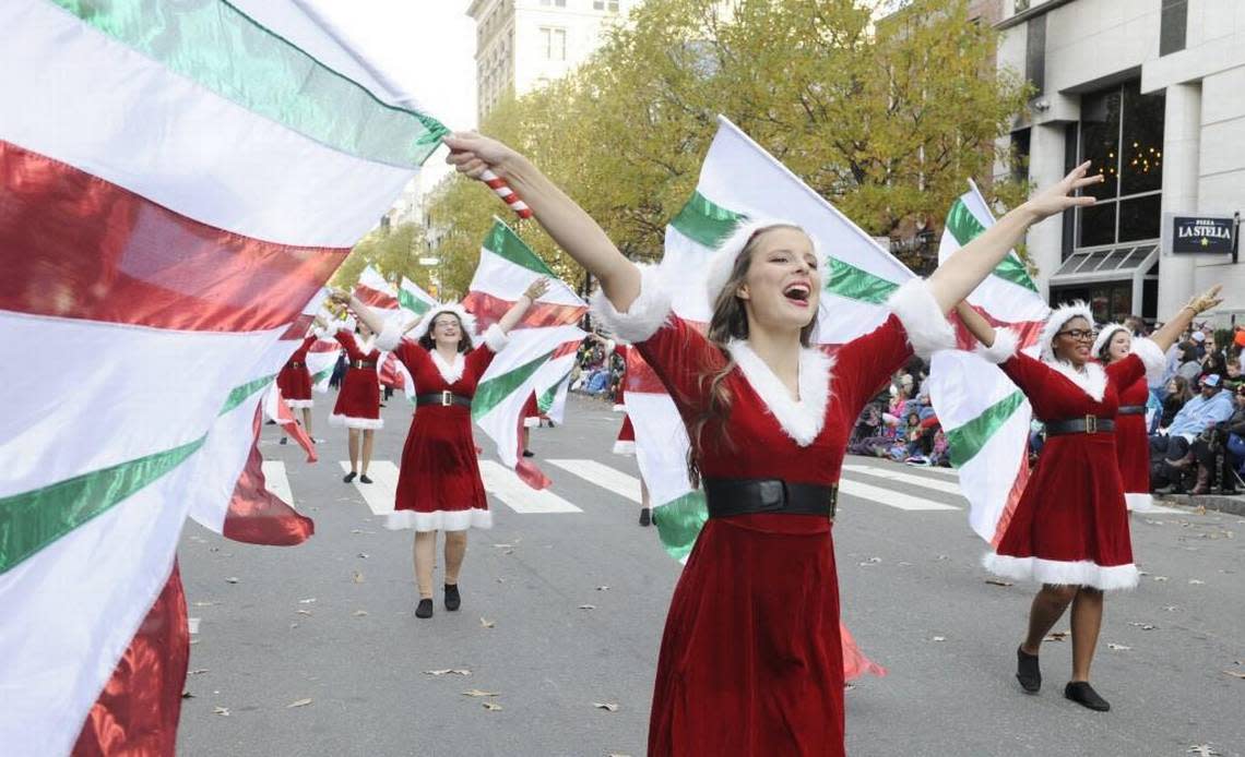 Apex Friendship High School senior Haley Patrick performs with the color guard in the Raleigh Christmas Parade in Raleigh, N.C. on Saturday, November 18, 2017.