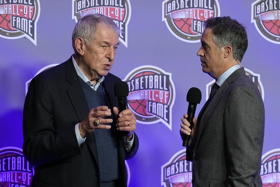 Jerry Colangelo, left, chairman of the Naismith Memorial Basketball Hall of Fame, speaks with Matt Winer during the Basketball Hall of Fame news conference Friday, Feb. 16, 2024, in Indianapolis. (AP Photo/Darron Cummings)