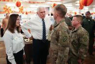 U.S. Vice President Pence and his wife greet troops after helping to serve a Thanksgiving meal to U.S. troops in a dining facility at Camp Flores on Al Asad Air Base, Iraq