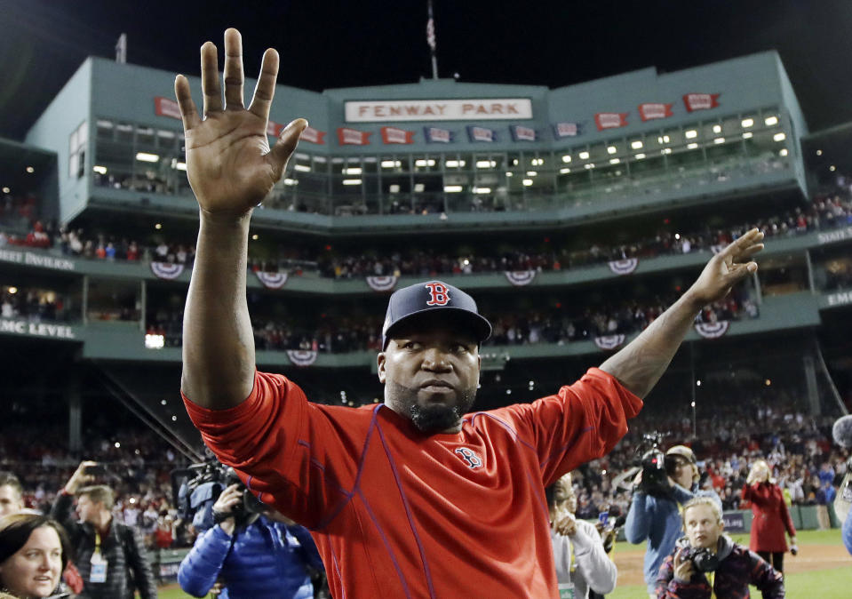 FILE - In this Oct. 10, 2016, file photo, Boston Red Sox's David Ortiz waves from the field at Fenway Park after Game 3 of baseball's American League Division Series against the Cleveland Indians in Boston. Former Red Sox slugger David Ortiz is out of the hospital following three surgeries after being shot in the back at a bar in the Dominican Republic. The Red Sox said on Saturday, July 27, 2019 that they've been told Ortiz has been released from Massachusetts General Hospital. The team said there will be an update on his condition next week. (AP Photo/Charles Krupa, File)