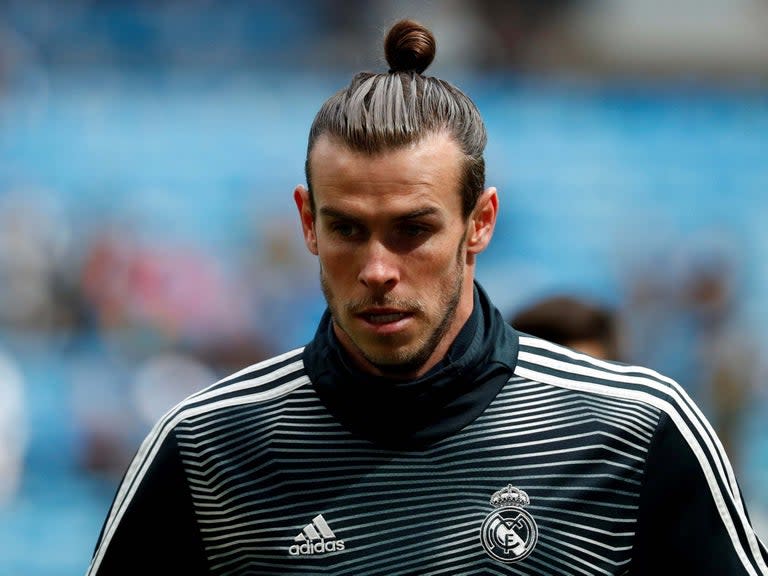 Gareth Bale’s agent has called Zinedine Zidane “a disgrace” after the Real Madrid manager openly discussed the Wales international’s imminent departure from the club.Zidane left Bale out of his squad that faced Bayern Munich overnight in the United States, and admitted after the match that the reason for his omission is due to “the club working on his departure”.Zidane refused to name the club that is in talks to sign Bale, but he did reveal that he hopes the deal goes through as soon as possible because the forward is not part of his plans this season, adding that it could be completed as early as Monday.But in response to the revealing comments, Bale’s agent Jonathan Barnett has launched a verbal attack on Zidane to criticise him for discussing the 30-year-old’s situation and making a thinly-veiled attempt to force Bale out of the club."Zidane is a disgrace to speak like that about someone who has done so much for Real,” Barnett told ESPN."If and when Gareth goes it will be because it is in the best interest of Gareth and nothing to do with Zidane pushing."The Independent revealed last week that Madrid president Florentino Perez had suggested to Zidane to bring Bale back into the squad as their summer transfer plans were being hampered by the inability to sell him.But after Zidane made it clear that Bale is not going to play any part in his plans for the season ahead, the club have pressed on with negotiating his departure.The Frenchman also said he hopes a deal for Bale can be struck soon "for everyone's sake".Zidane, whose side were beaten 3-1 by Bayern, said in quotes reported on his club's official website: "He wasn't included in the squad because the club is working on his departure and that's why he didn't play."We'll have to see what happens in the coming days. We'll have to see if it goes through tomorrow, if it does then all the better. Let's hope, for everyone's sake, that it happens soon. The club is dealing with the club that he'll move to."Bale joined Real for a then world-record £86m from Tottenham in 2013 and, despite being hit by a series of injuries, has helped the Spanish powerhouses win four Champions League titles, La Liga and a host of other trophies.However, his future at the Bernabeu has been the source of plenty of speculation in recent times, with the likes of Manchester United, Tottenham, Bayern and Inter Milan among the clubs having been linked with his services.Zidane did not reveal where Bale's possible destination might be but said: "The situation will change and it's for the best for everyone."The Frenchman also insisted he has "nothing against" Bale, who has not always been an automatic starter under Zidane at Real.Zidane added: "It's nothing personal. There comes a time when things are done because they need to be done."I've not got anything against him. We have to make decisions and change things, that's all there is to it. You're aware of the situation and there'll be a change to it. I don't know if this will happen in 24 or 48 hours' time."The situation will change and it's for the best for everyone. That's how things go."I speak with the club, we've got decisions to make and it's a decision that's been made by the coach and the player. Let's see how things play out."