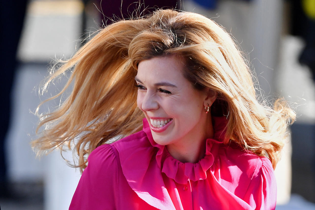 Carrie Symonds, the girlfriend of Prime Minister Boris Johnson, wore a hot pink number at the Conservative Party Conference [Photo: Getty Images]