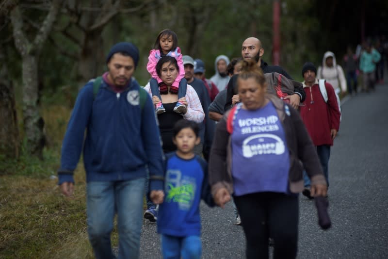 Hondurans take part in a caravan of migrants heading toward the U.S., in Chiquimula