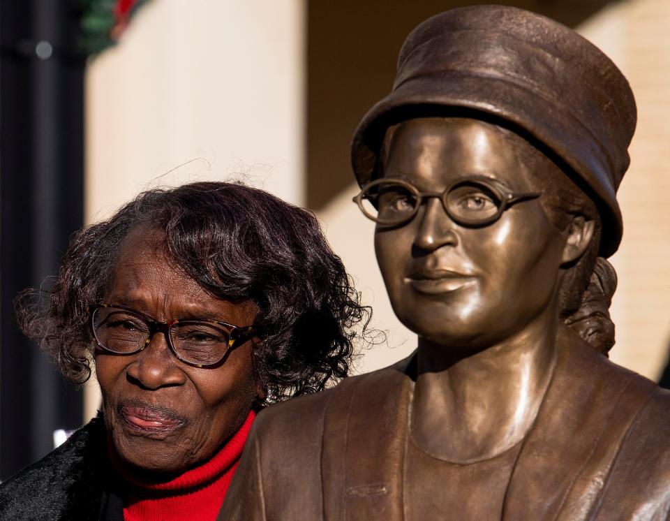 Mary Louise Smith, a plaintiff in the Browder vs. Gayle case that desegregated buses in Montgomery, stands beside the Rosa Parks statue in downtown Montgomery, Ala., after it was unveiled on Sunday, December 1, 2019. The Greater Washington Park Community Association honored her family by placing a marker detailing the family's history with the civil rights movement.