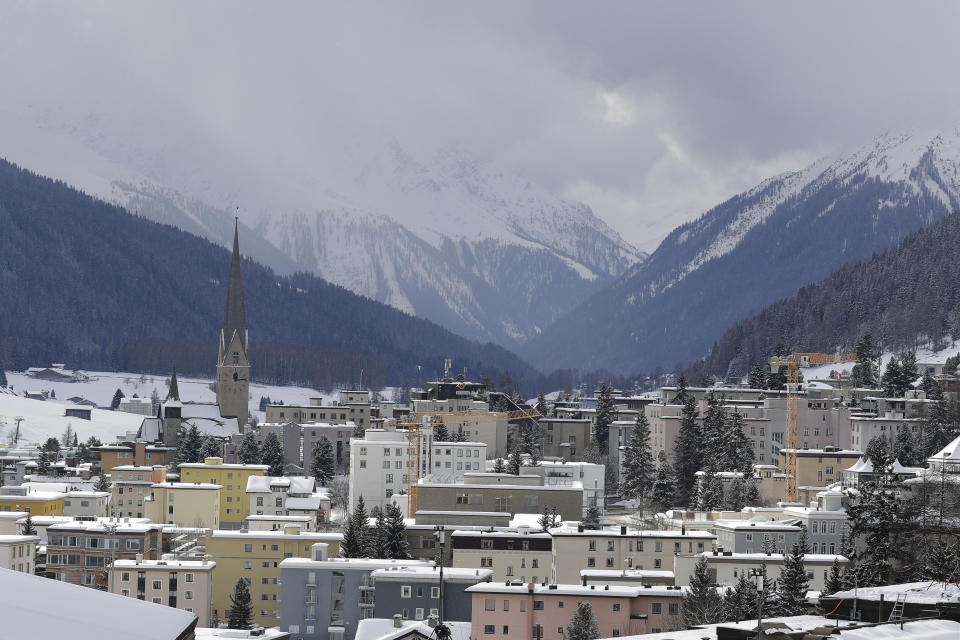 Snow covers the hills around Davos, Switzerland, Sunday, Jan. 19, 2020. The city will host the 50th annual meeting of the World Economic Forum from Jan. 20 until Jan. 24, 2020. (AP Photo/Markus Schreiber)