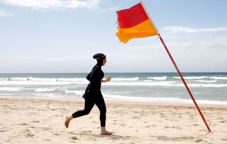 A woman on a beach in her burkini. (Photo: TIM WIMBORNE / Reuters)