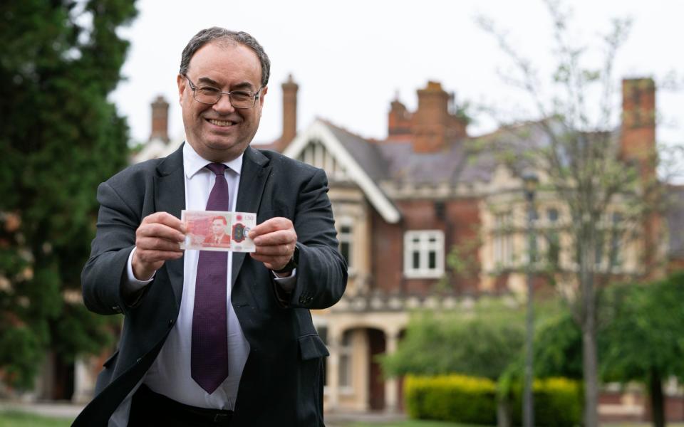 Andrew Bailey holding banknote - Joe Giddens/PA Wire