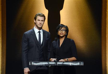 Actor Chris Hemsworth (L) and Academy of Motion Picture Arts and Sciences President Cheryl Boone Isaacs announce the nominees for the 86th Academy Awards in Beverly Hills, California January 16, 2014. REUTERS/Phil McCarten