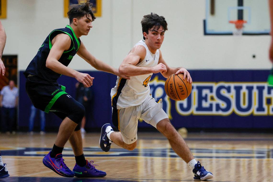 Belen Jesuit guard Javi Rosell (4) drives to the basket as TERRA guard Jordan Del Rio (3) defends during the first quarter of a basketball Region 4-5A quarterfinal game at Belen Jesuit Preparatory School in Miami, Florida on Thursday, February 16, 2023. SAM NAVARRO/Special for the Miami Herald