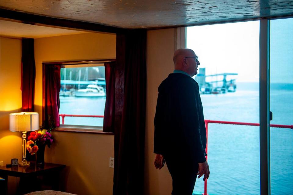 Dennis Redmon looks out the sliding doors in the master bedroom on the second deck of the Annabelle.