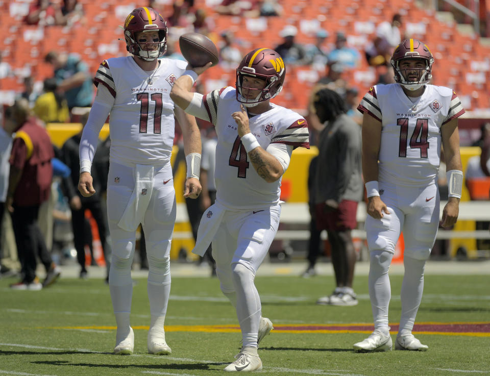 Carson Wentz, left, struggled while Taylor Heinicke and Sam Howell both got their shots this season. (John McDonnell/The Washington Post via Getty Images)