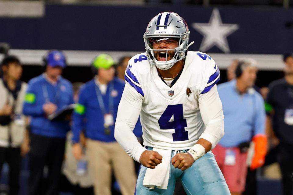 Dallas Cowboys quarterback Dak Prescott (4) celebrates after throwing a touchdown pass to Jake Ferguson, not pictured, in the second half of an NFL football game against the Seattle Seahawks in Arlington, Texas, Thursday, Nov. 30, 2023.