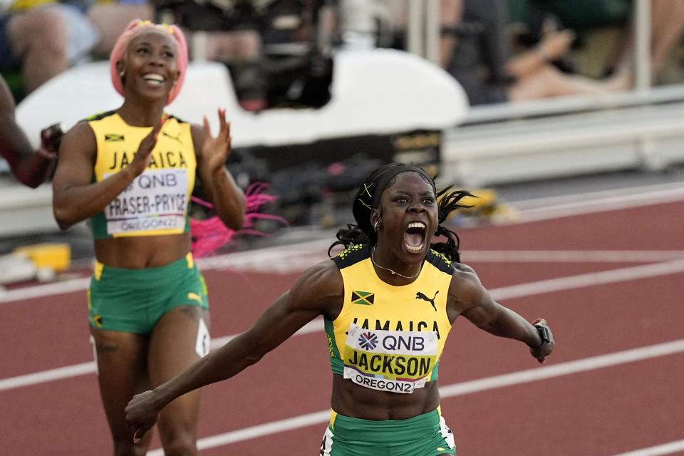 Jamaica's Shericka Jackson celebrates after running the 200 meters in the second-fastest time ever, 21.45 seconds, to lead a Jamaican 1-2 finish ahead of Shelly-Ann Fraser-Pryce, at the World Athletics Championships, in Eugene, Ore., Thursday, July 21, 2022. (AP Photo/Gregory Bull)