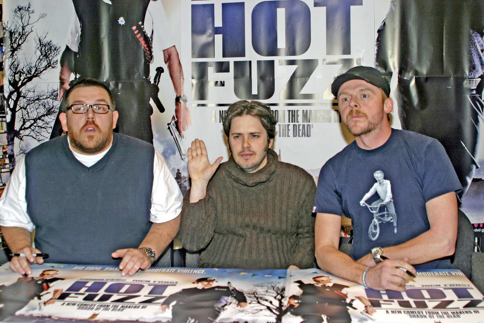Nick Frost, Edgar Wright and Simon Pegg signing Hot Fuzz merchandise in advance of the film's release at the HMV store in Manchester on Wednesday 7th February 2007, from 5pm.; Job: 18937 Ref: PSN -    (Photo by Peter Simpson/Avalon/Getty Images)