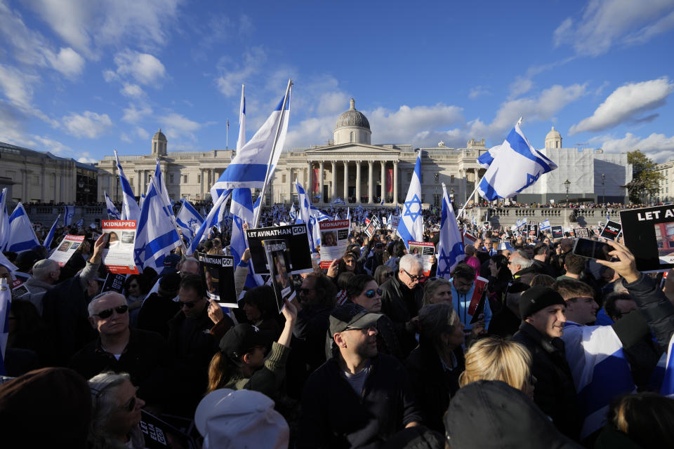 Israeli supports show placards with the faces and names of people believed to be taken hostage and held in Gaza, during a protest in Trafalgar Square, London, Sunday, Oct. 22, 2023. They demanding the release of all hostages allegedly taken by the militant group Hamas. (AP Photo/Frank Augstein)