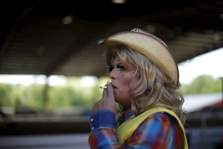Mipsy Mikels, 50, smokes a cigarette at the International Gay Rodeo Association's Rodeo In the Rock in Little Rock, Arkansas, United States April 25, 2015. REUTERS/Lucy Nicholson
