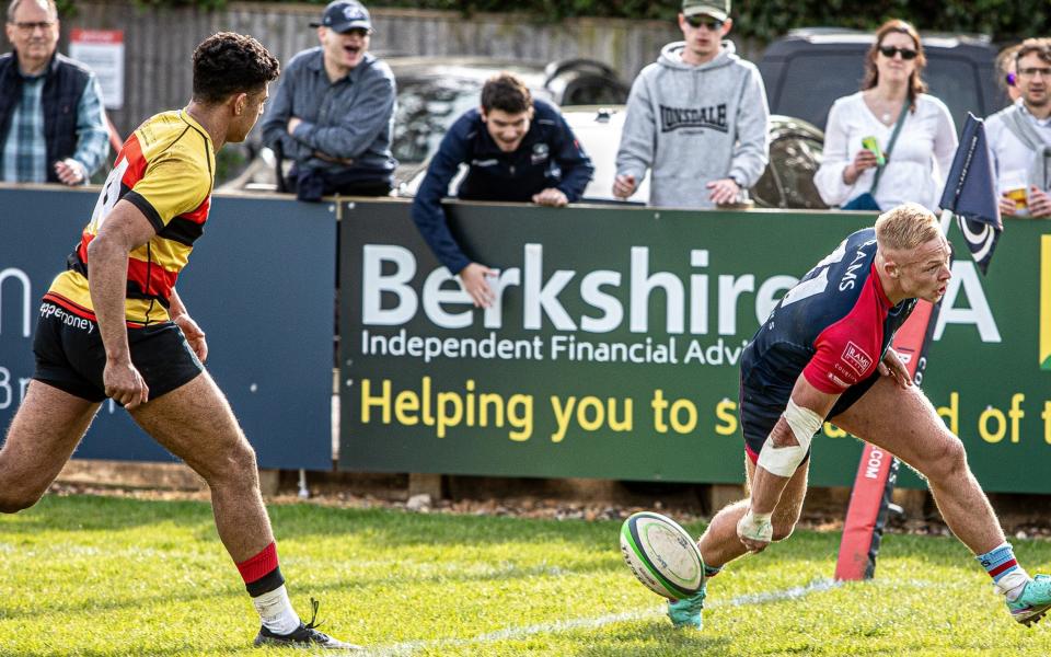 Charlie Robson scores a try for Rams