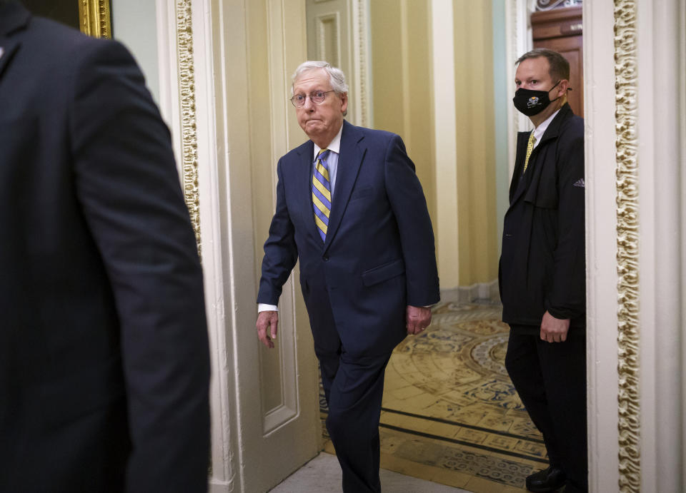 Senate Minority Leader Mitch McConnell, R-Ky., arrives at the Capitol in Washington, Wednesday, Oct. 6, 2021, as a showdown looms with Democrats over raising the debt limit. (AP Photo/J. Scott Applewhite)