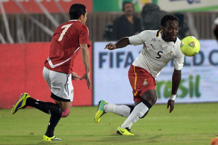 Ghana's Michael Essien (R) runs for the ball during a World Cup 2014 African qualifier second leg play-off against Egypt, in Cairo, on November 19, 2013