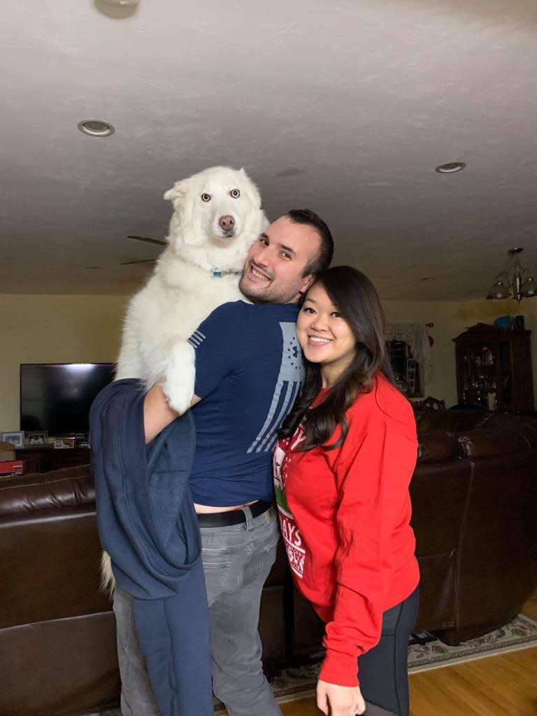 Luna, the lovable and sometimes goofy Siberian husky, with Sam Rouabhia and his wife, Victoria Lee, of Quincy.