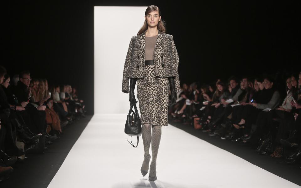 Fashion from the Badgley Mischka Fall 2014 collection is modeled during New York Fashion Week on Tuesday Feb. 11, 2014. (AP Photo/Bebeto Matthews)