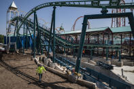 Construction is underway in the amusement park district of Coney Island, Friday, June 17, 2022, in the Brooklyn borough of New York. Luna Park in Coney Island will open three new major attractions this season alongside new recreational areas and pedestrian plazas. (AP Photo/John Minchillo)