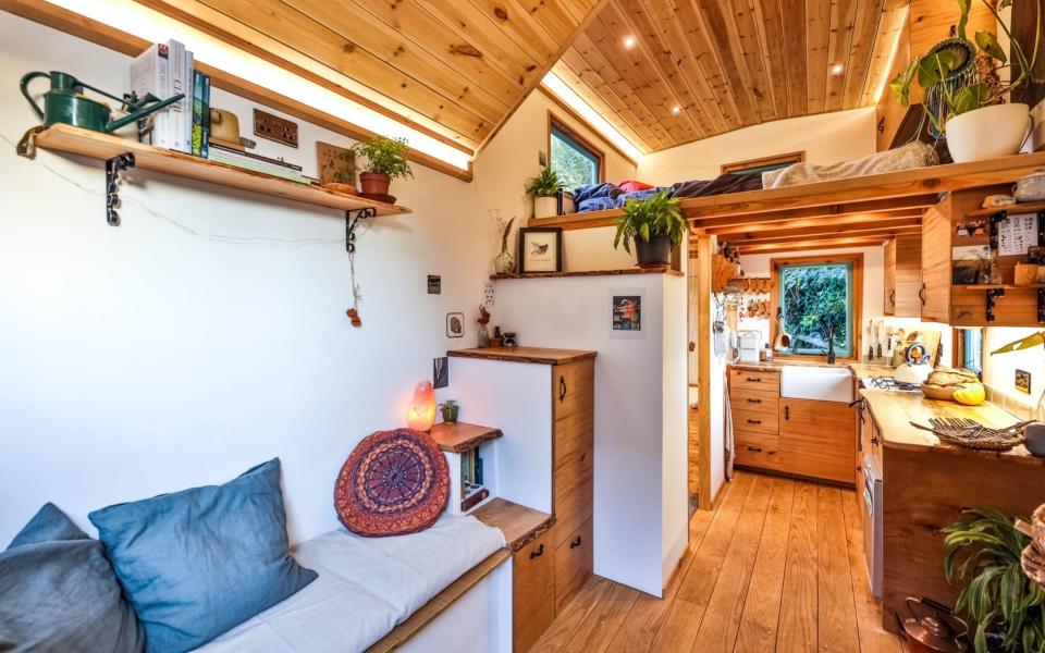 Hamer wanted to showcase these beautiful pieces of wood by letting the rustic aesthetic stand out against the white walls  - Living Large in a Tiny House 