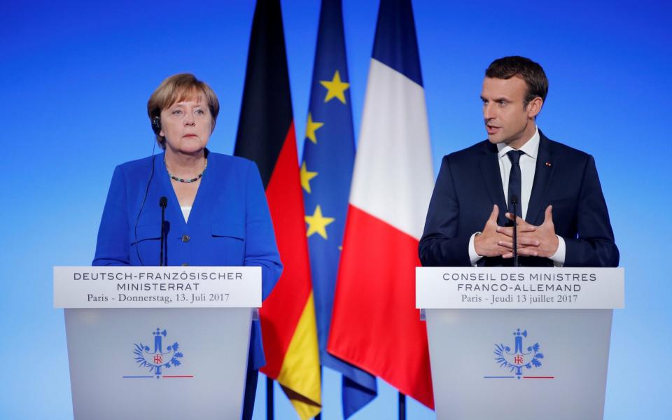 French president Emmanuel Macron and German chancellor Angela Merkel. Their countries both saw 0.6pc growth in the last three months of 2017 - REUTERS