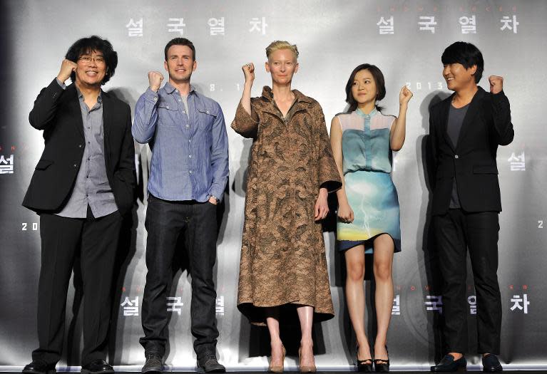 (L to R) South Korean director Bong Joon-ho, actor Chris Evans, actress Tilda Swinton, Ko A-Sung and actor Song Kang-Ho pose during the world premiere press conference of Bong's first English language film "Snowpiercer" in Seoul on July 29, 2013