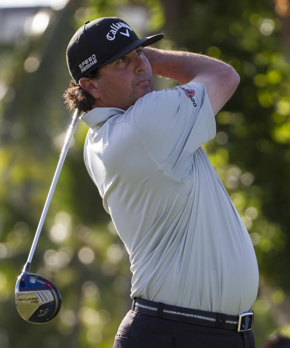 Pat Perez hits his golf ball off the first tee during the third round of the Sony Open golf tournament at Waialae Country Club, Saturday, Jan. 11, 2014, in Honolulu. (AP Photo/Eugene Tanner)