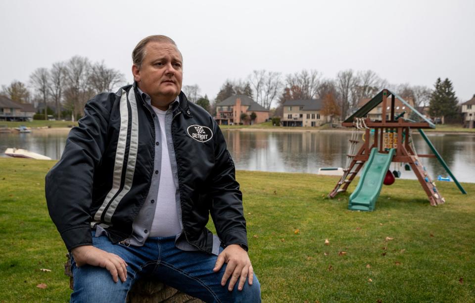 David Markiewicz, 45, of Shelby Township, sits next to a playscape for his children at his home on Saturday, Nov. 12, 2022. Markiewicz and his ex-wife are fighting over custody of a frozen embryo, Markiewicz wants to dispose of it, and his ex-wife wants to carry it and have another baby. According to Markiewicz, one of his reasons for wanting to dispose of the embryo is not getting to be a part of that baby's life.