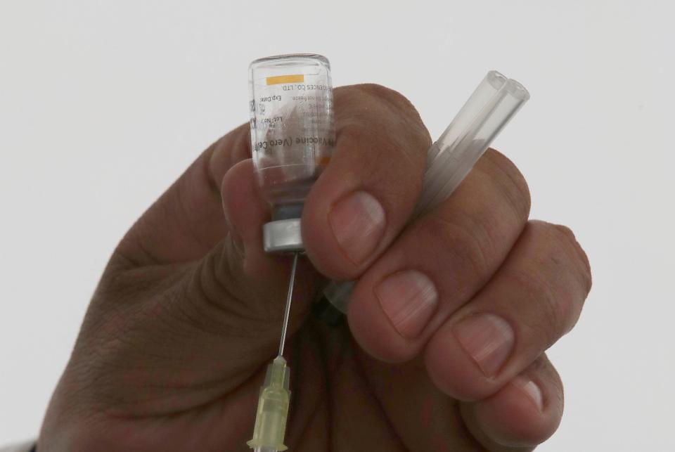 A health worker prepares a dose of the Sinovac Biotech COVID-19 vaccine to be administered at the Americas sports center in Ecatepec, a borough on the outskirts of Mexico City, Tuesday, Feb. 23, 2021. (Foto AP/Marco Ugarte