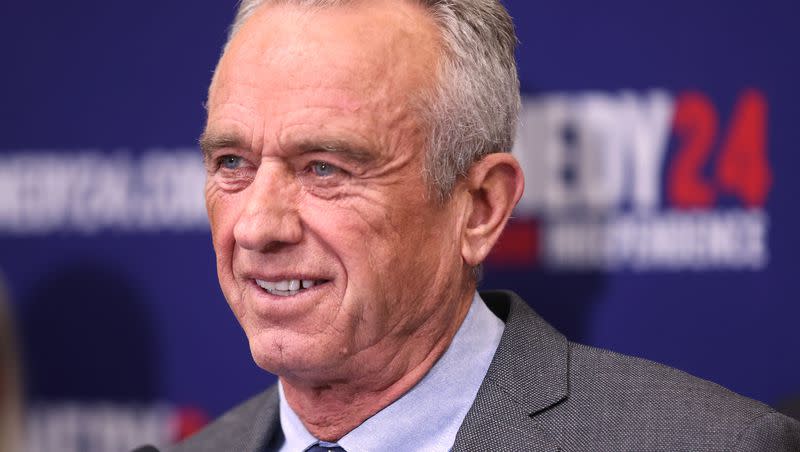 Independent presidential candidate Robert F. Kennedy Jr. smiles while speaking during a press conference at the Capitol in Salt Lake City on Jan. 3, 2024. An ad created by RFK’s  super PAC that appeared during Sunday’s Super Bowl drew backlash from his own family.