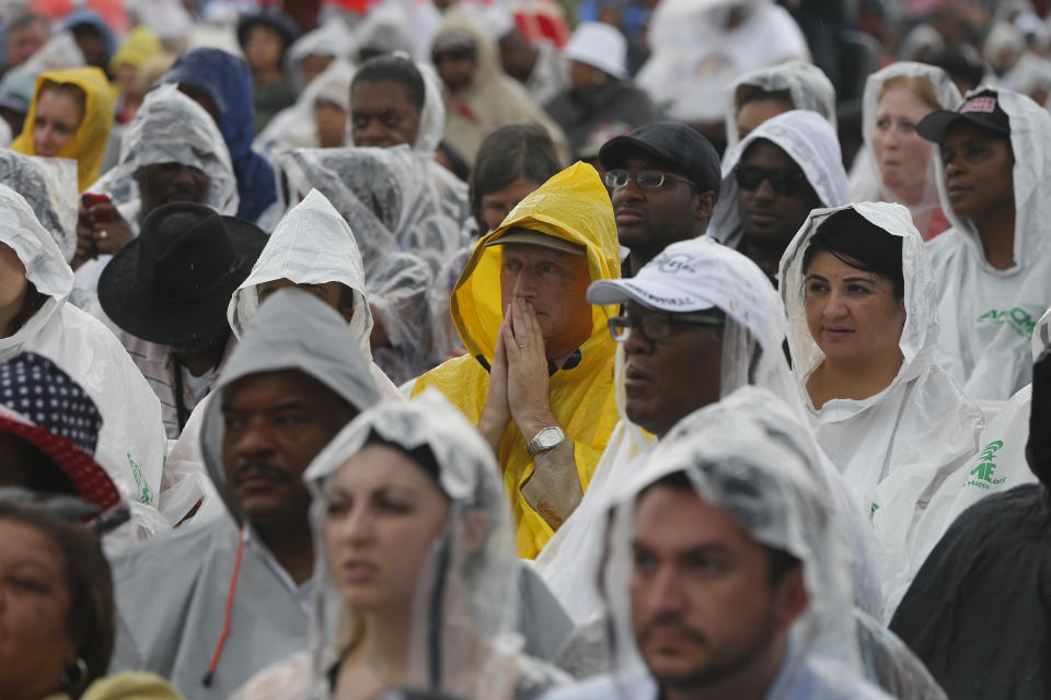 FILE - Audience members wear ponchos during a light rain at the 50th Anniversary of the March on Washington where the Rev. Martin Luther King Jr., spoke in front of the Lincoln Memorial in Washington, Wednesday, Aug. 28, 2013. (AP Photo/Charles Dharapak, File)