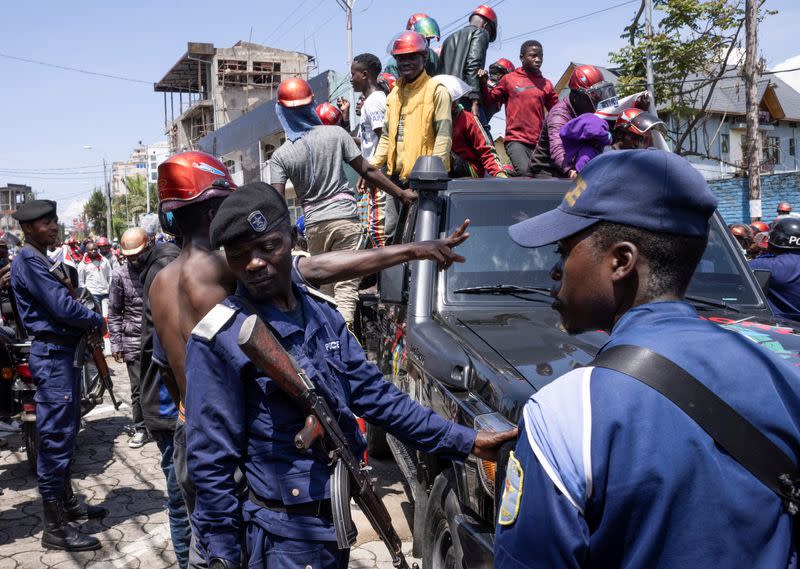 Congolese policemen maintain order during a civil society protest against the Luanda agreement in Goma