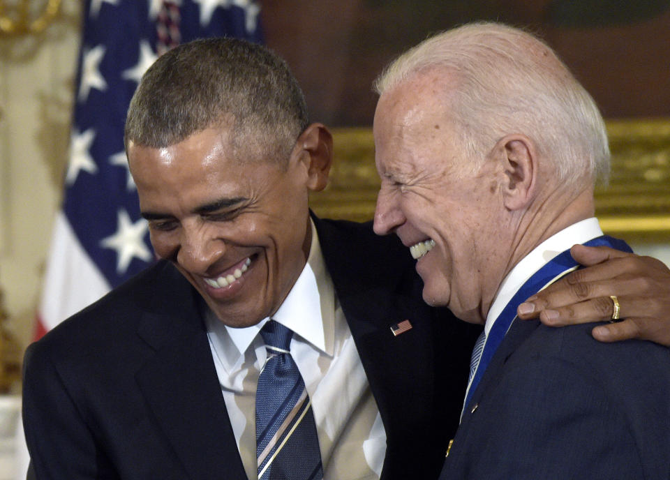 FILE - In this Jan. 12, 2017 file photo, President Barack Obama laughs with Vice President Joe Biden during a ceremony in the State Dining Room of the White House in Washington where Obama presented Biden with the Presidential Medal of Freedom. Since leaving the White House nearly four years ago, former President Barack Obama has repeatedly called for a new generation of political leaders to step up. On Wednesday, he’ll implore Americans to vote for Joe Biden, a 77-year-old who has been on the national political stage for more than four decades. (AP Photo/Susan Walsh)