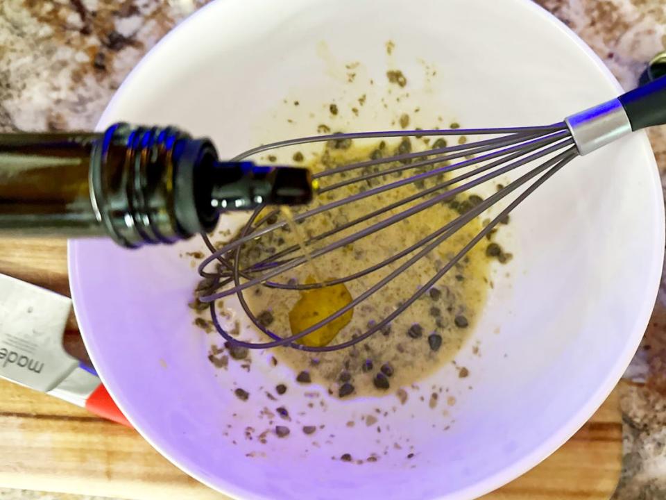 Dressing with dijon mustard, capers, olive oil, and lemon juice.