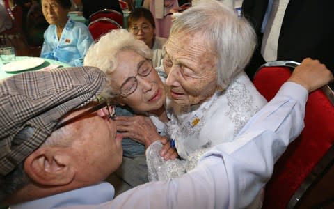 South Koreans Jo Hye-do, 86, and Jo Do-jae, 75, meet their North Korean sister Jo Soon Do, 89 - Credit: AFP/AFP 