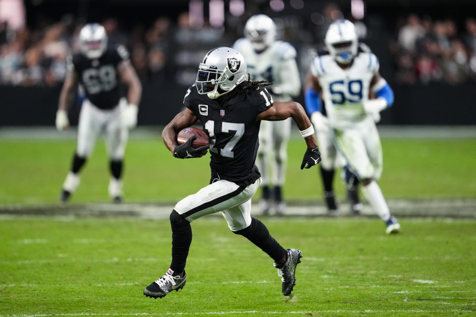 Las Vegas Raiders wide receiver Davante Adams (17) runs for a touchdown after a catch against the Indianapolis Colts in the second half of an NFL football game in Las Vegas, Fla., Sunday, Nov. 13, 2022. (AP Photo/Matt York)