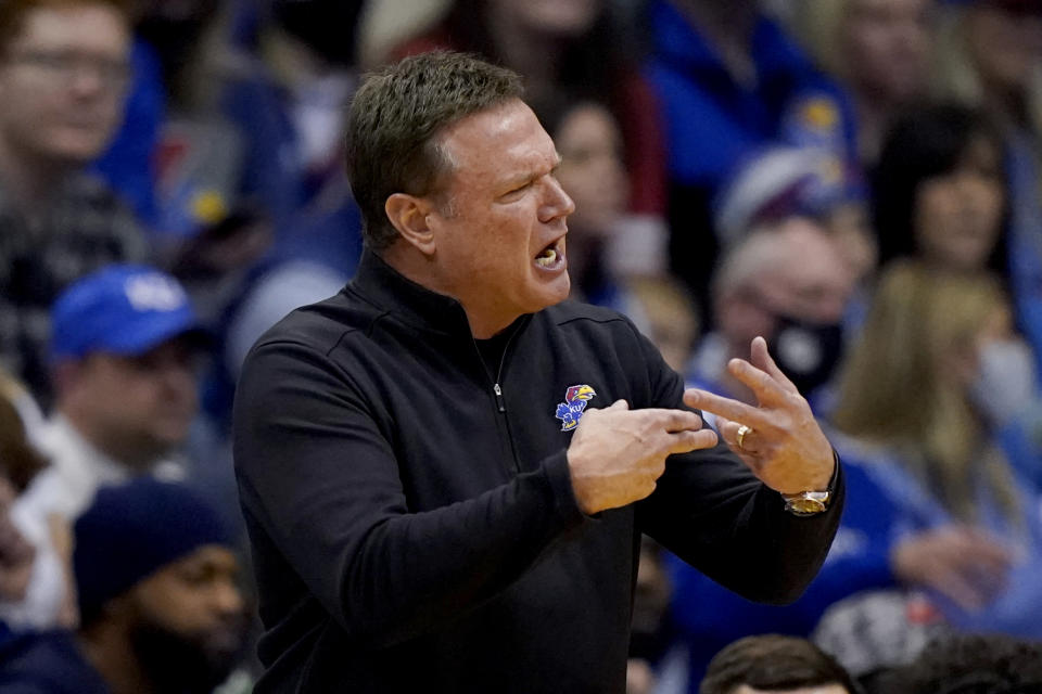 Kansas head coach Bill Self talks to his players during the first half of an NCAA college basketball game against Nevada Wednesday, Dec. 29, 2021, in Lawrence, Kan. (AP Photo/Charlie Riedel)