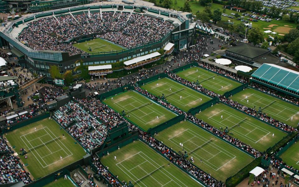 An aerial view a roofless Centre Court and the outside courts taken from the BBC elevated camera position during day four of the Wimbledon Lawn Tennis Championships at the All England Lawn Tennis and Croquet Club - - GETTY IMAGES