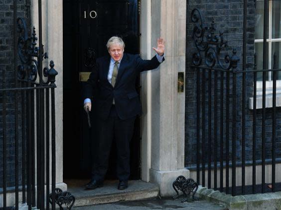 Johnson leaves No 10 to deliver a post-victory speech yesterday (EPA)